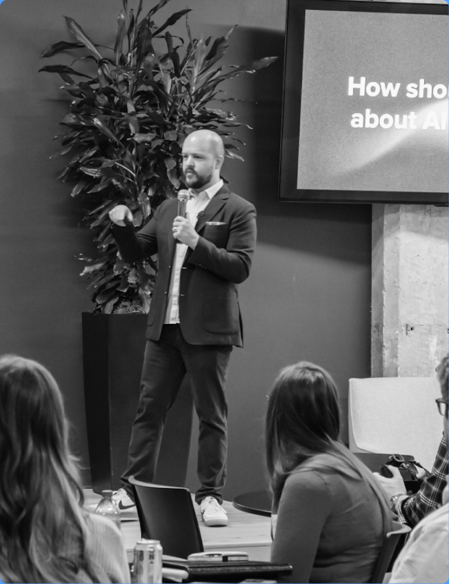 A speaker presenting at a sponsored Birmingham AI event